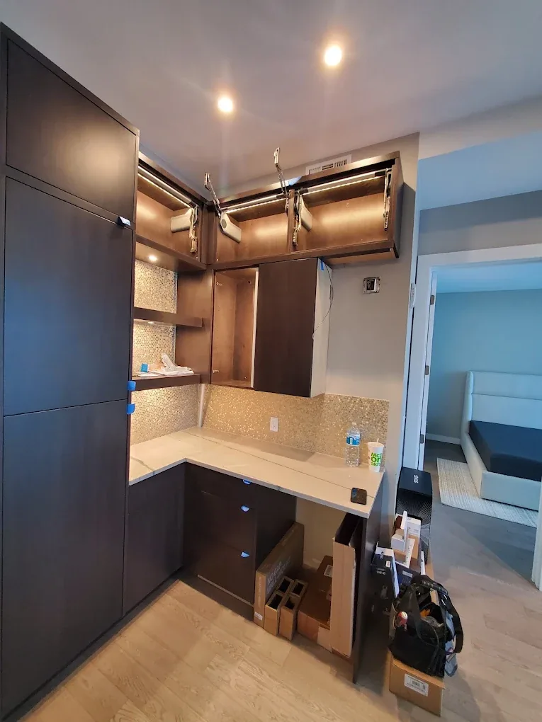 Kitchen with under-cabinet lighting and recessed cans installed