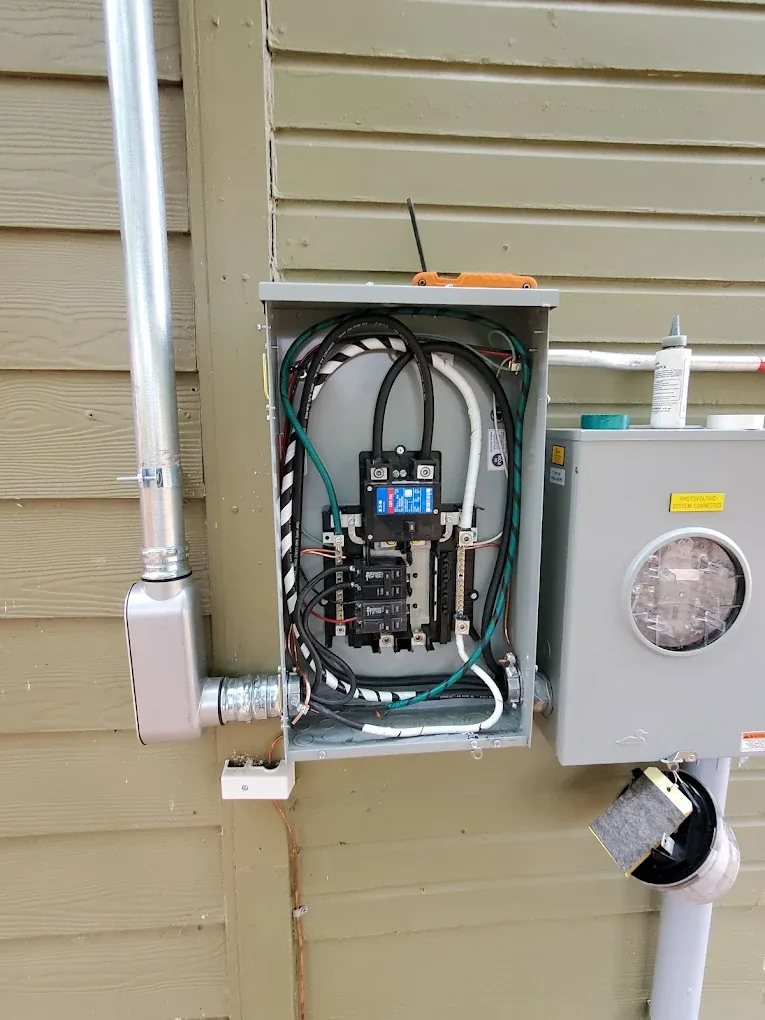 Exterior service disconnect and meter base opened for diagnostic work