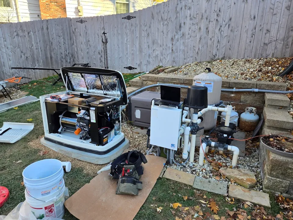Whole-home standby generator being installed beside pool equipment